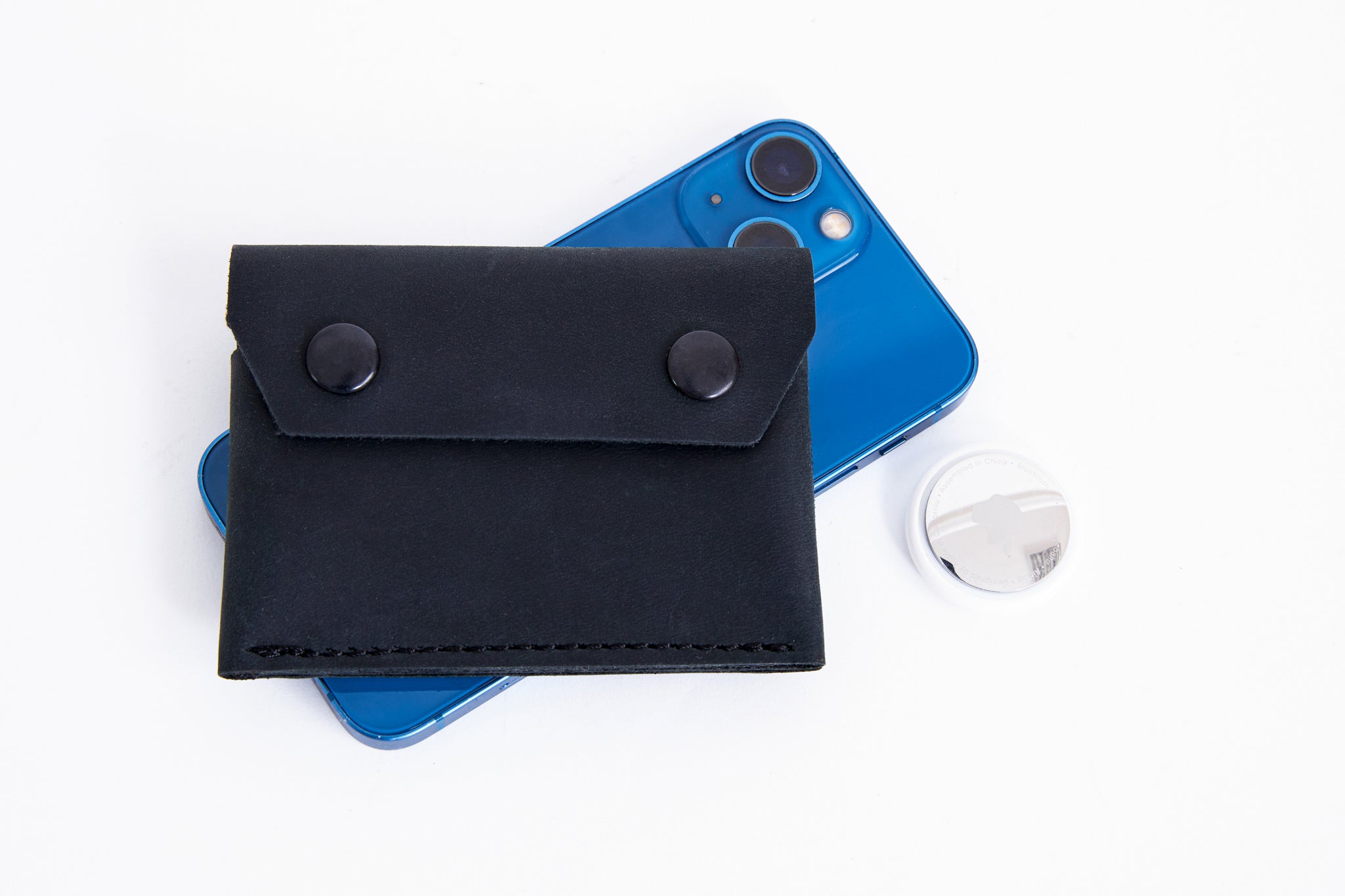 Black leather wallet with AirTag slot