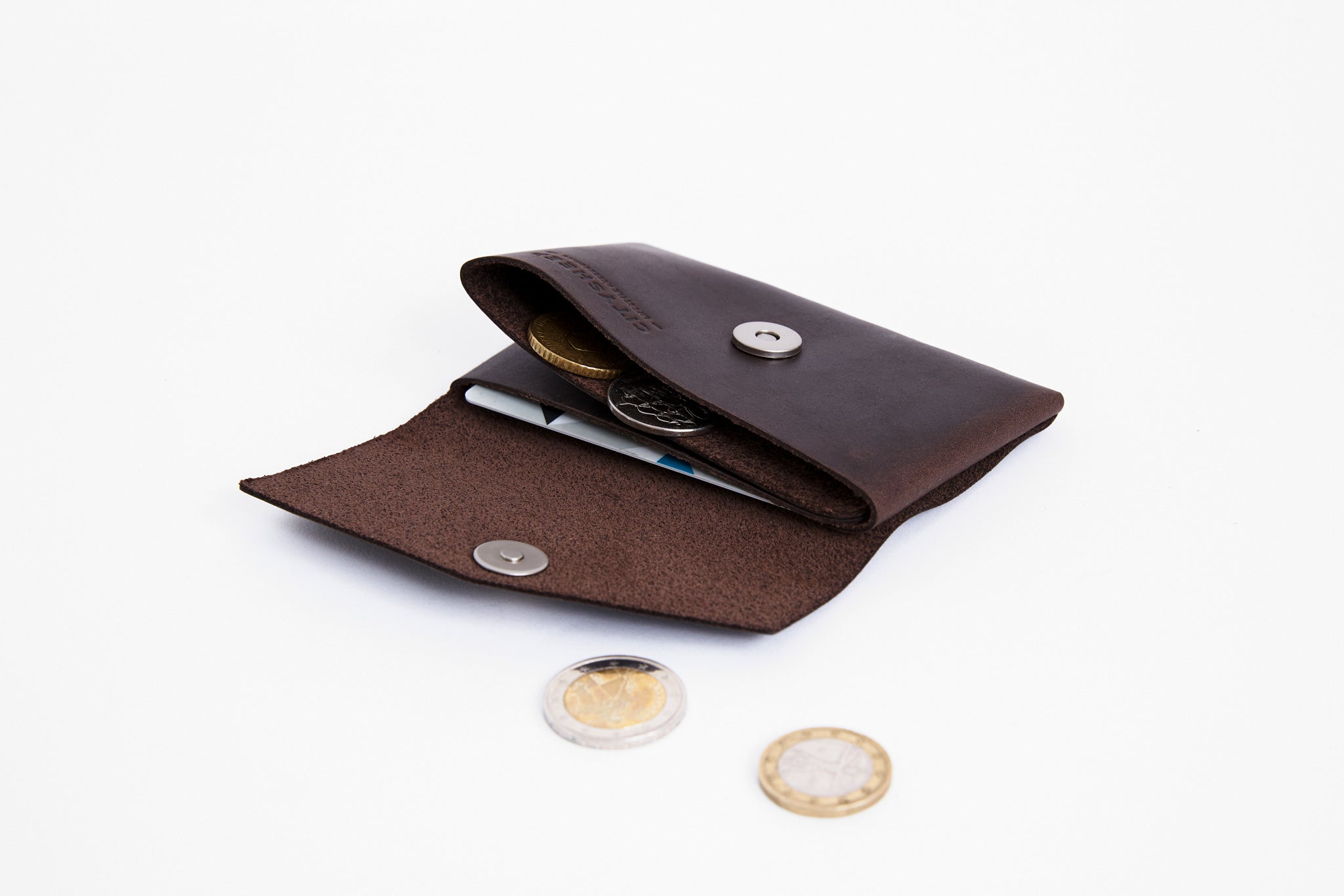 Brown leather minimalist wallet fits in pocket