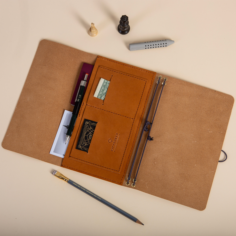 Trifold leather journal with pockets and loop for a pen