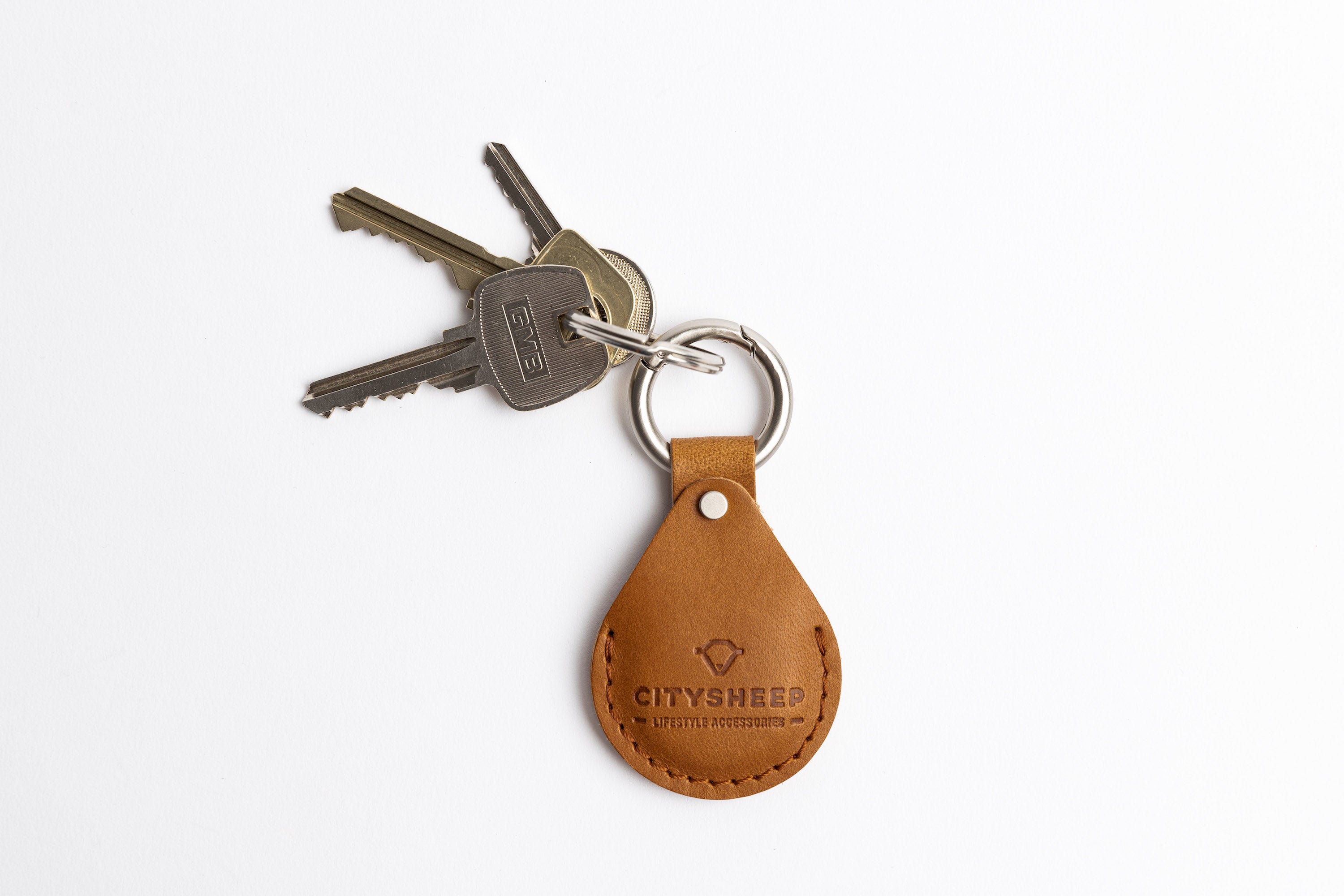 Handcrafted leather AirTag holder fully covered, made from Italian Vegetable tanned leather.