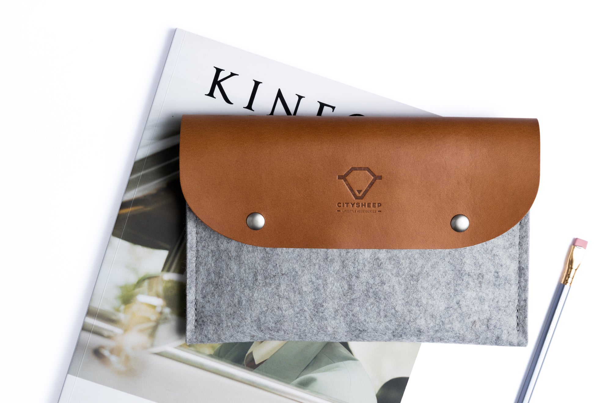 Handcrafted cable organizer made from Vegetable tanned leather and wool felt