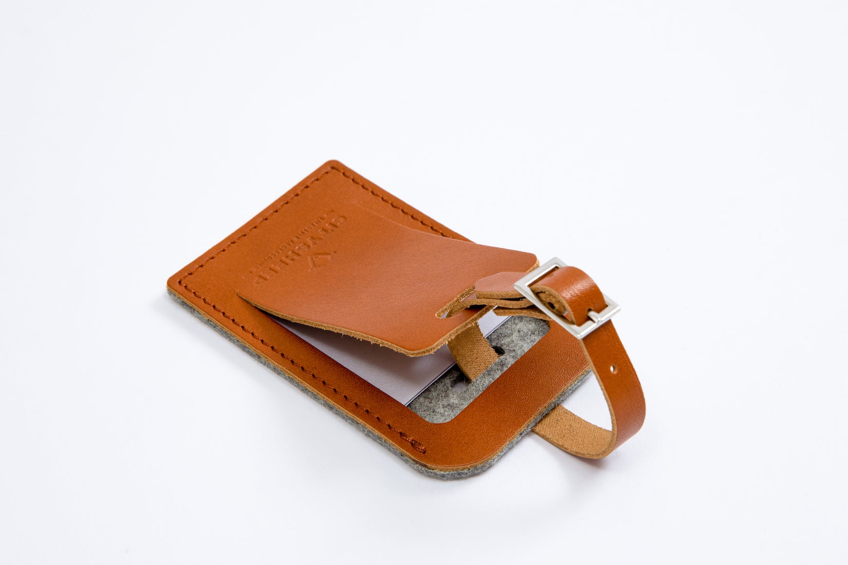 Strong and long lasting leather luggage tag with hidden address details.