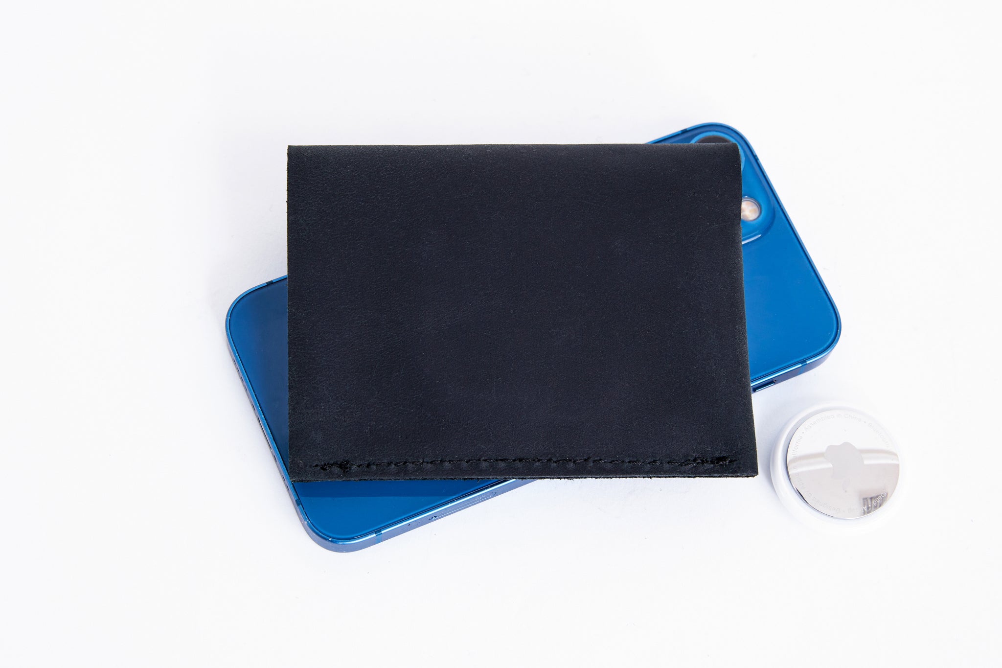 Mens wallet with AirTag slot for cards and cash.