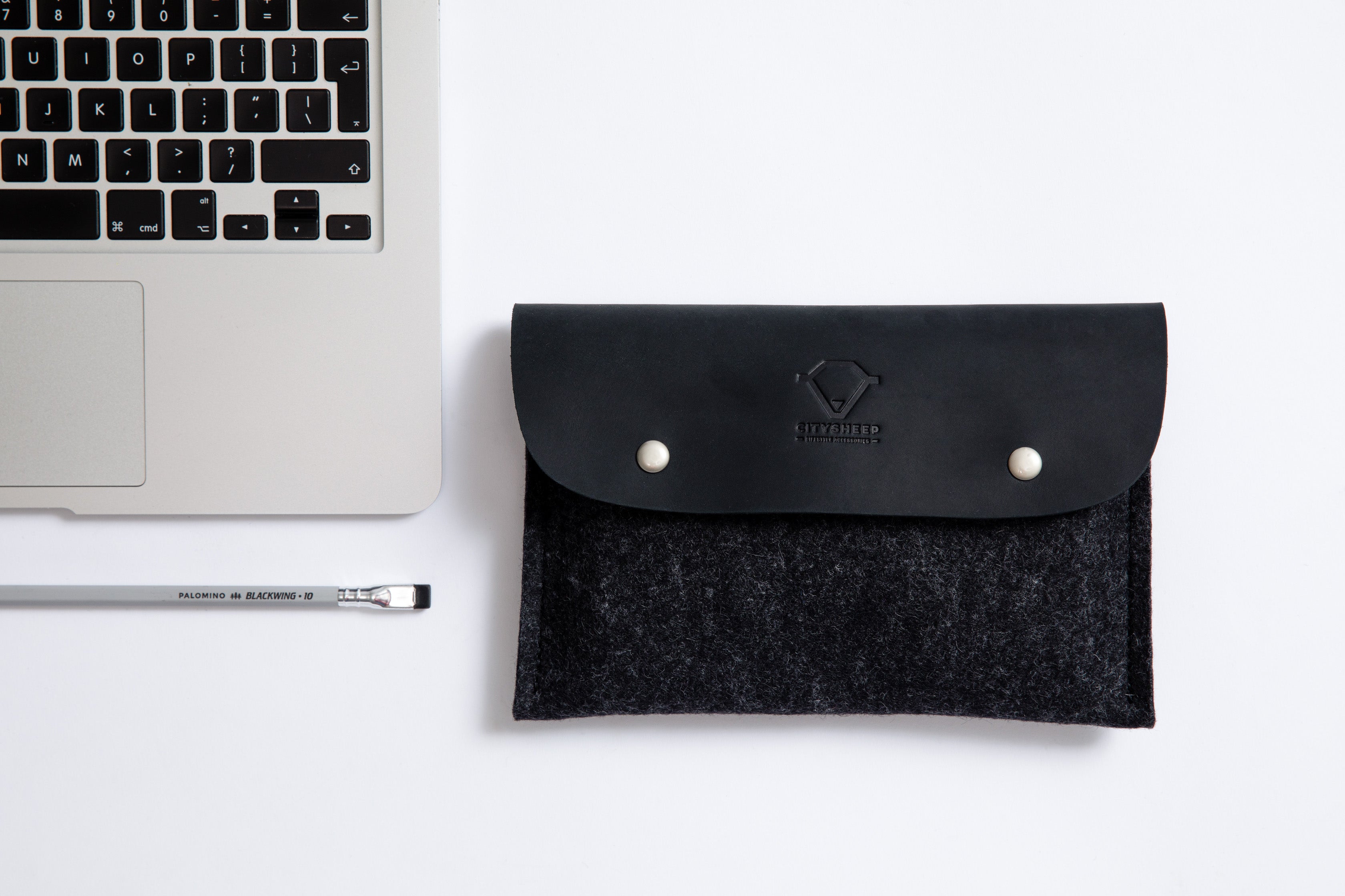 small tech pouch to store all your tech accessories. Made from wool felt and full grain leather.