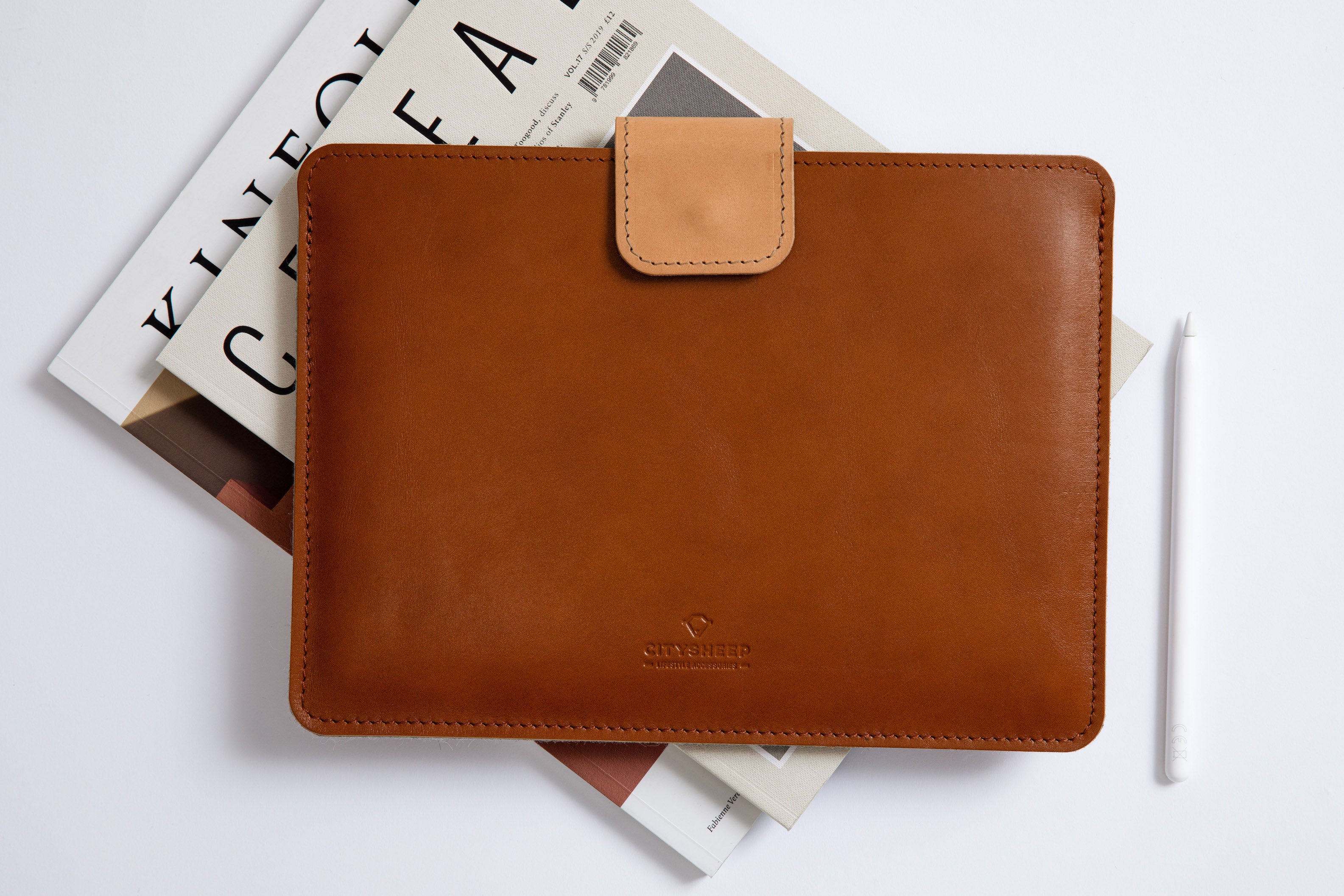 Italian Vegetable tanned leather iPad sleeve with pencil holder. Lined with merino wool felt. Magnetic closure