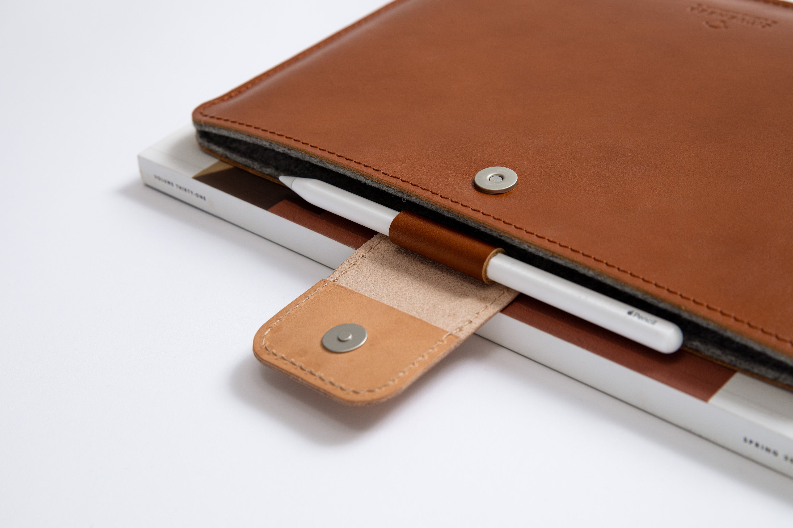 Protective Leather MacBook Sleeve with loop for a pen and magnetic closure